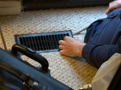 A ProTech technician going to work cleaning a customer's air ducts.